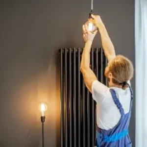 handyman-replacing-lightbulb-at-home-1